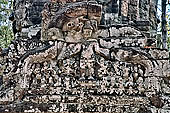 Ta Som temple - western gopura III, fronton  showing a standing bodhisattva surrounded by worshippers